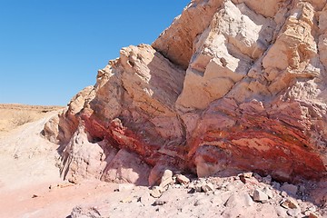 Image showing Striped pink rock in stone desert 