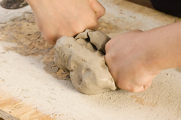 Image showing Child hands of a potter