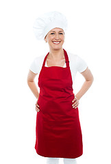 Image showing Female cook posing with hands on her waist