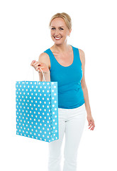 Image showing Shopping woman carrying bag, enjoying sale