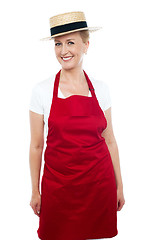 Image showing Trendy middle aged cheerful cook wearing hat