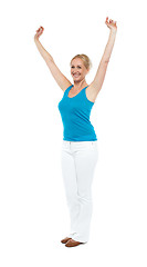 Image showing Successful woman posing with raised arms