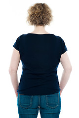 Image showing Rear view of curly haired stylish caucasian woman