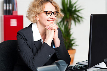 Image showing Relaxed portrait of beautiful aged corporate woman