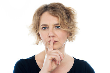 Image showing Woman gesturing silence, closeup shot