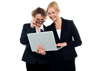 Image showing Business friends enjoying video on laptop