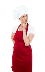 Image showing Thoughtful female chef looking away