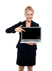 Image showing Business lady indicating towards laptop screen