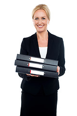 Image showing Female executive carrying business files