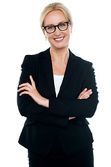 Image showing Businesswoman with crossed arms wearing glasses