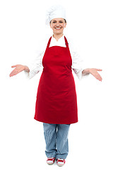 Image showing Female chef welcoming you with a smile