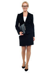 Image showing Female secretary holding clipboard, full length shot