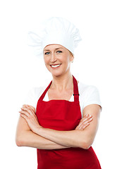 Image showing Middle aged female chef posing with crossed arms