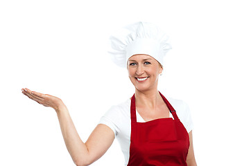 Image showing Smiling senior cook showing copy space