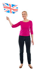 Image showing Aged patriotic lady waving United Kingdom flag