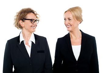 Image showing Aged corporate women looking at each other