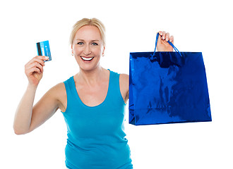 Image showing Shopper woman holding bag and credit card