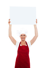 Image showing Chef holding advertising board over her head