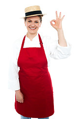 Image showing Beautiful woman in hat gesturing excellent sign