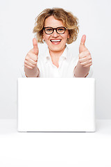 Image showing Joyful senior executive showing double thumbs up