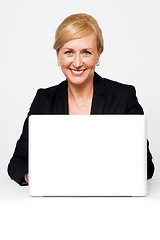 Image showing Aged corporate lady working on a laptop