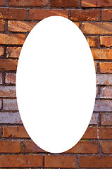 Image showing Red brick wall background and white oval in center 