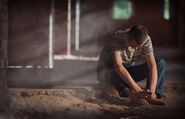 Image showing Thoughtful man sitting