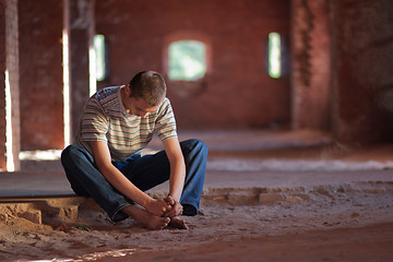 Image showing Thoughtful man sitting