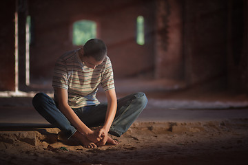 Image showing Thoughtful man sitting