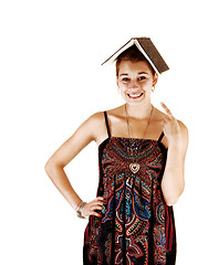 Image showing Girl with book on head.