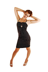 Image showing Pretty girl in striped dress.