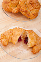 Image showing croissant French brioche filled with berries jam