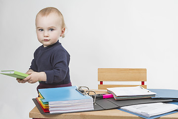 Image showing young child at writing desk