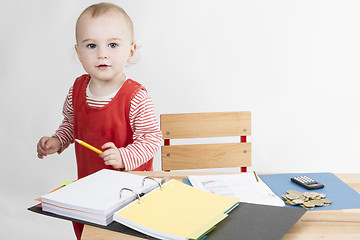 Image showing young child at writing desk