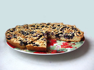 Image showing Fresh pie with bilberry on the white background