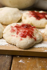 Image showing Sweet doughnuts with rose marmelade