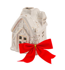 Image showing Small white house and red band ribbon. Christmas present. 