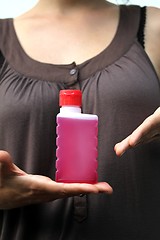 Image showing red fluid in hands