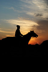 Image showing horse and rider at sunrise