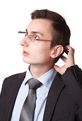Image showing Young businessman in glasses thinking