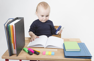 Image showing young child at writing desk