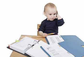 Image showing young child at writing desk