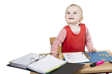 Image showing young child at writing desk