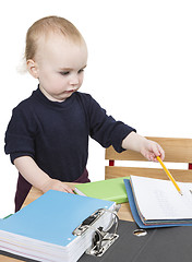 Image showing young child at writing desk