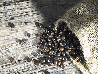 Image showing coffee beans on weathered wood