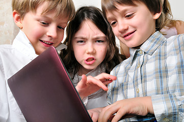 Image showing group of children friends playing studying at laptop