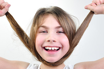 Image showing funny girl playing with her hair