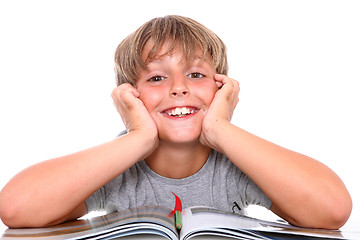 Image showing Smiling schoolboy with book 