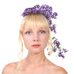 Image showing Portrait of young beautiful woman with flower in long blond hair