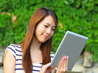 Image showing young woman using tablet touch computer